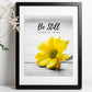 Inspirational Word Art - Be Still and know that I am God - Yellow Daisy Wall Decor (8x10 print) | bible verse Psalm 46:10 wall decor in black frame on white wall next to babys breath | oak7west.com