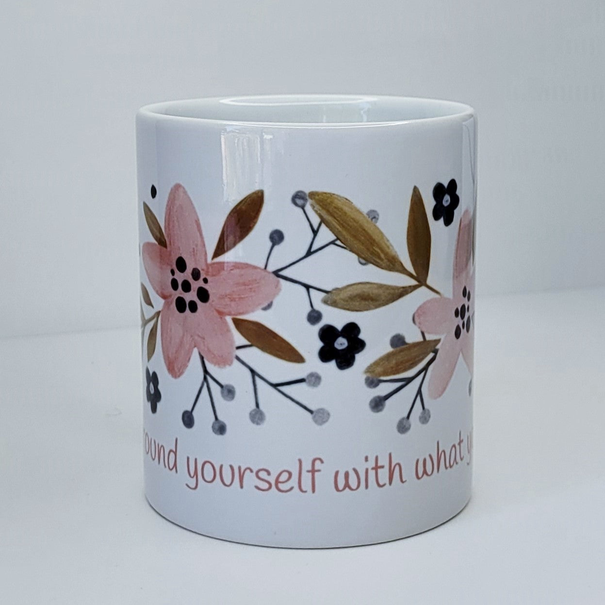 Surround yourself with what you love coffee mug (exclusive design) | lovely crisp white with a floral print in pinks, tans, and navy blue, finished off with the words "Surround yourself with what you love" in a fun pink font | 11 ounce coffee cup | oak7west.com