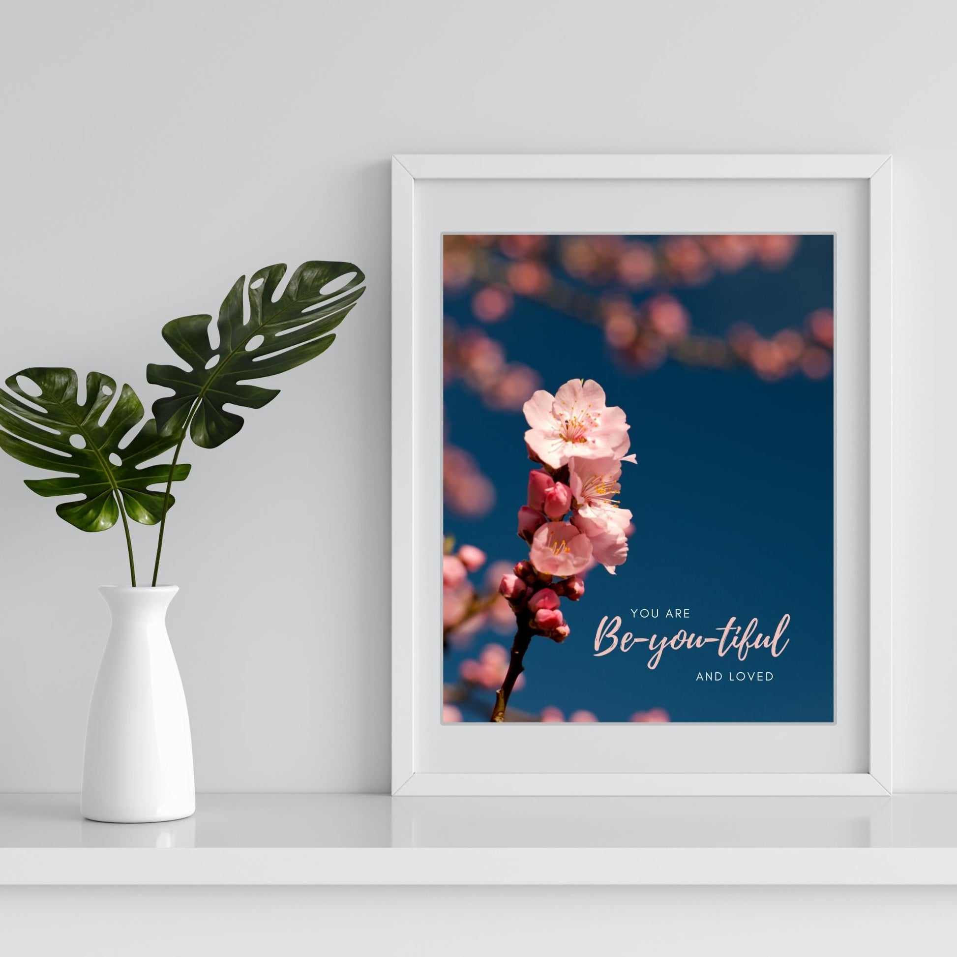 Inspirational Word Art - YOU ARE Be-you-tiful AND LOVED - Pink Flowering Branch Wall Decor (8x10 print) | Shown in a white frame on a white tabletop next to greenery | oak7west.com