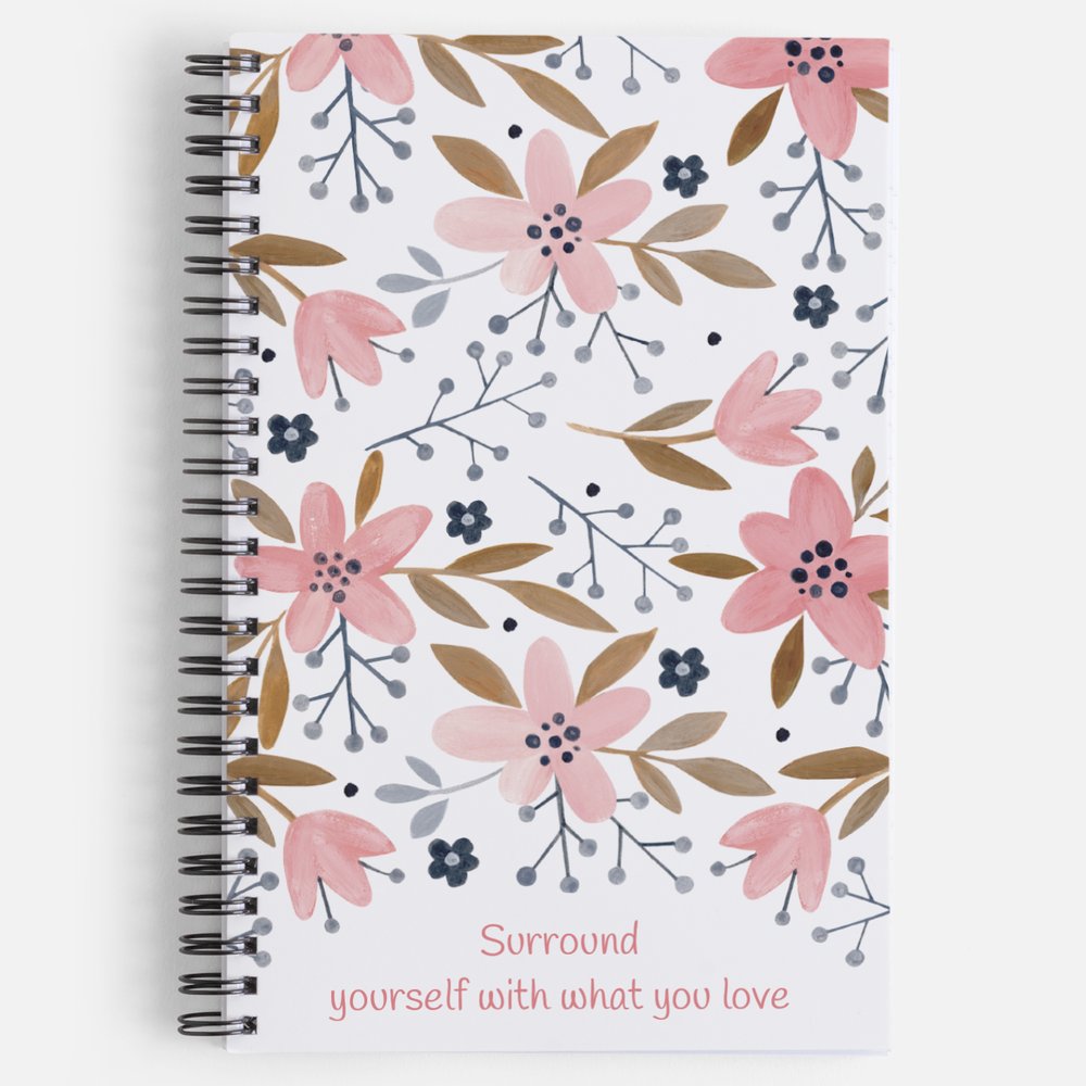 Our exclusive notebook designed in-house has a cute floral print in pinks, tans, and navy blue. The cover reads "Surround yourself with what you love" in a fun pink font. The floral design also decorates the back cover with the words "be a blessing... today, tomorrow, always". | Front cover shown | oak7west.com