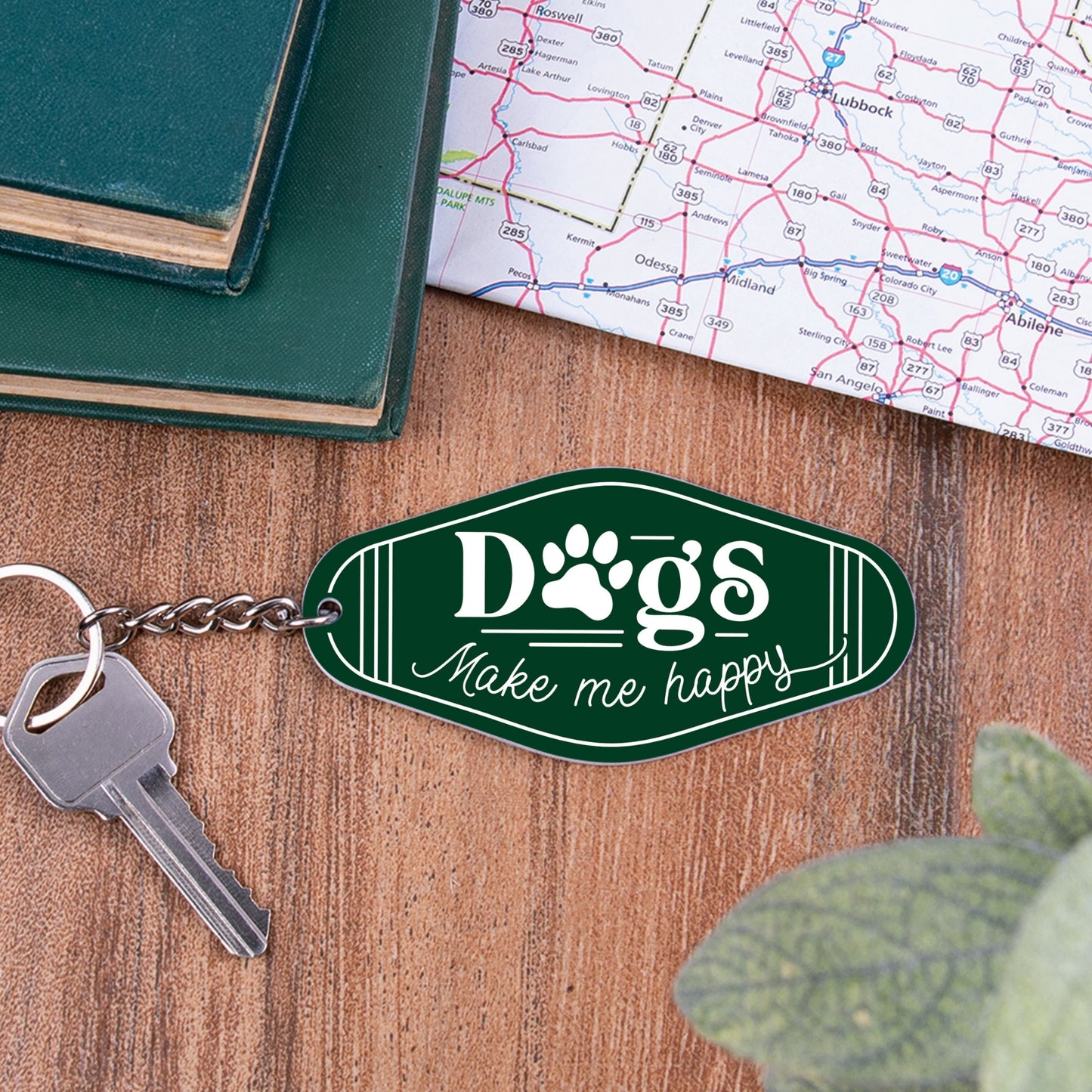 Acrylic Green Keychain - Dogs Make me happy on desk with books and map | oak7west.com