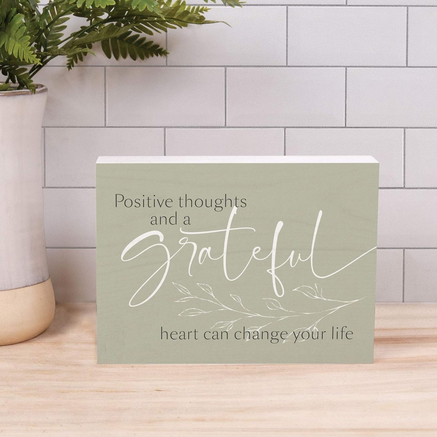 Positive thoughts and a grateful heart can change your life - Inspirational Word Wood Block shown on kitchen counter in front of white subway tile backsplash | oak7west.com