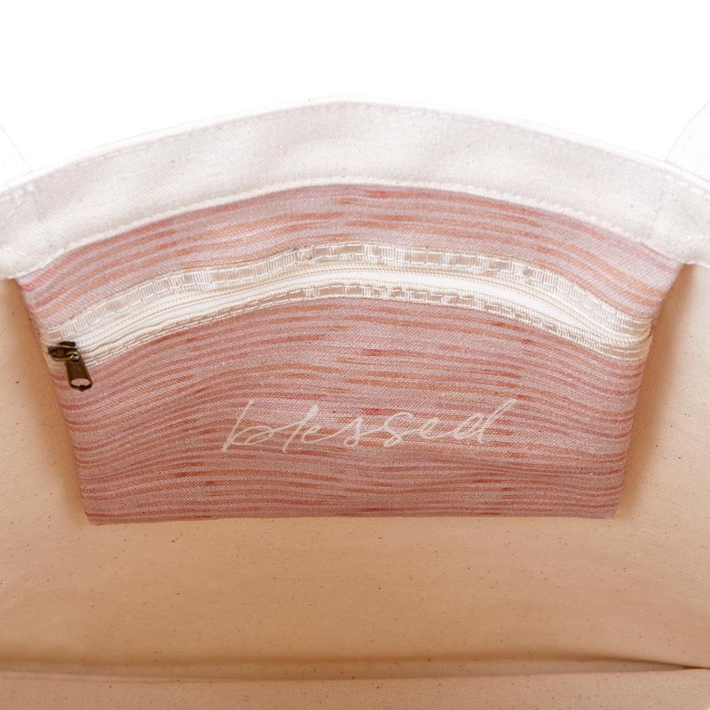 Close-up of zippered pouch inside floral canvas tote with 'blessed' printed for a daily reminder | oak7west.com