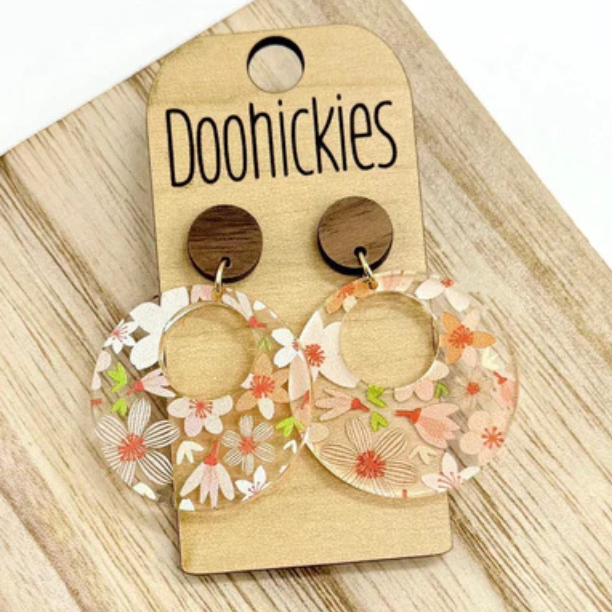Fall Floral Coral Dangle Earrings - Acrylic & Wood Circle Dangles against a wood background | oak7west.com