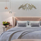 Italian Gold Olive Leaf Iron Wall Grille - Olive Branch Metal Wall Decor (42.5"W) over bed with grey bedding | oakwest.com