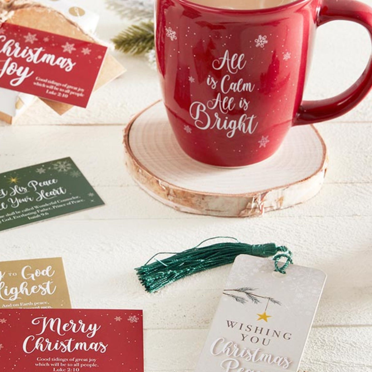 All is Calm All is Bright - Red Christmas Mug - Christian Drinkware shown with bookmark and wood coaster | oak7west.com