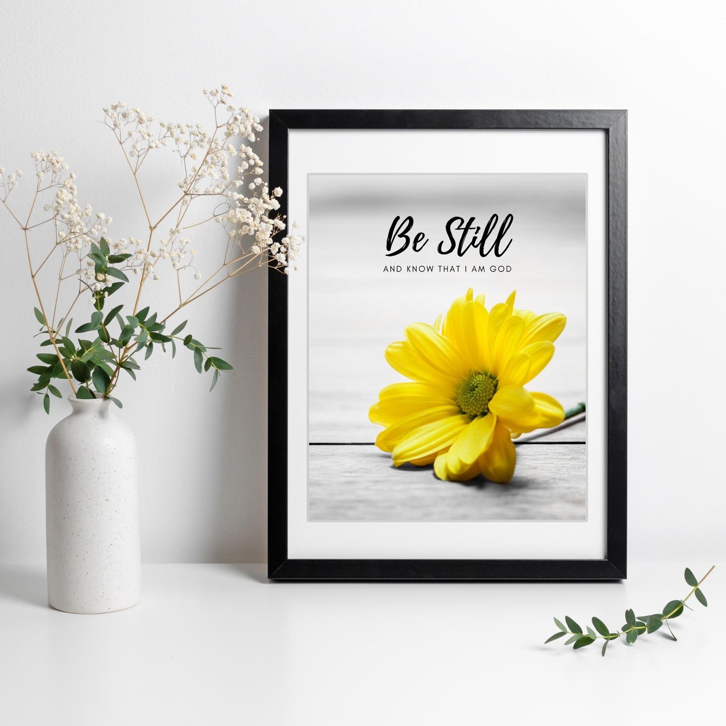 Inspirational Word Art - Be Still and know that I am God - Yellow Daisy Wall Decor (8x10 print) | bible verse Psalm 46:10 wall decor in black frame on white wall | oak7west.com