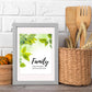 Inspirational Word Art - Family, where life begins and love never ends - Green Leaves Wall Decor (8x10 print) | shown in light grey frame on kitchen counter with white brick backsplash | oak7west.com