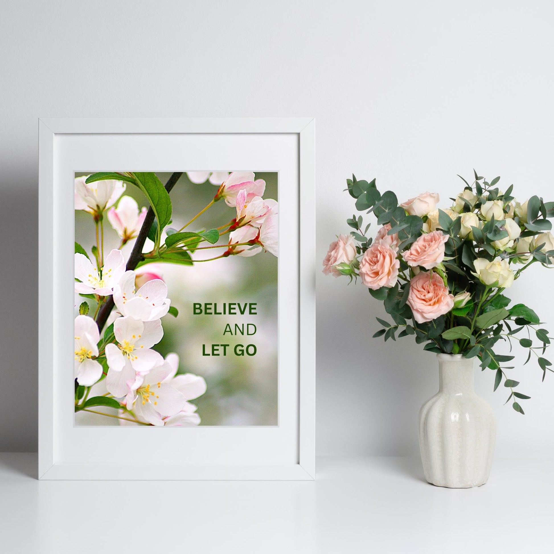 Inspirational Word Art - BELIEVE and LET GO - Pink and Green Floral Decor (8x10 print) | shown in white frame against white wall next to rose bouquet in vase | oak7west.com