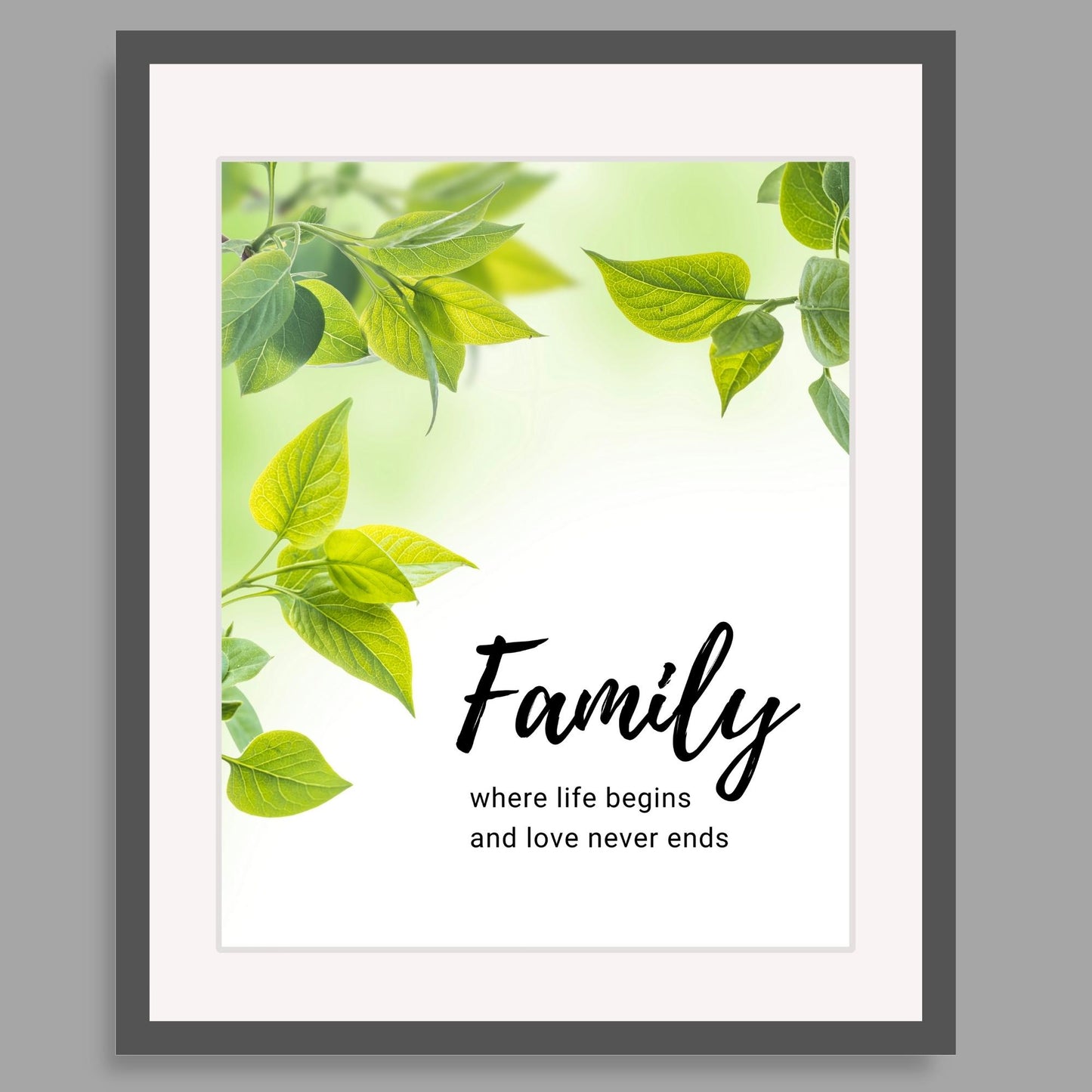 Inspirational Word Art - Family, where life begins and love never ends - Green Leaves Wall Decor (8x10 print) | shown in deep gray frame against light gray interior wall | oak7west.com